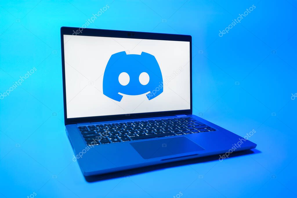 Prague, Czechia - 08 01 2025: A laptop on a uniform background displays the Discord logo. Discord is a platform for voice, video, and text communication.