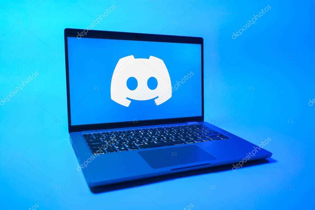Prague, Czechia - 08 01 2025: A laptop on a uniform background displays the Discord logo. Discord is a platform for voice, video, and text communication.
