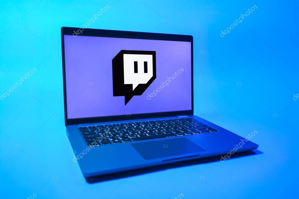 Prague, Czechia - 08 01 2025: A laptop on a uniform background displays the Twitch logo. Twitch is a platform for live streaming games and content.