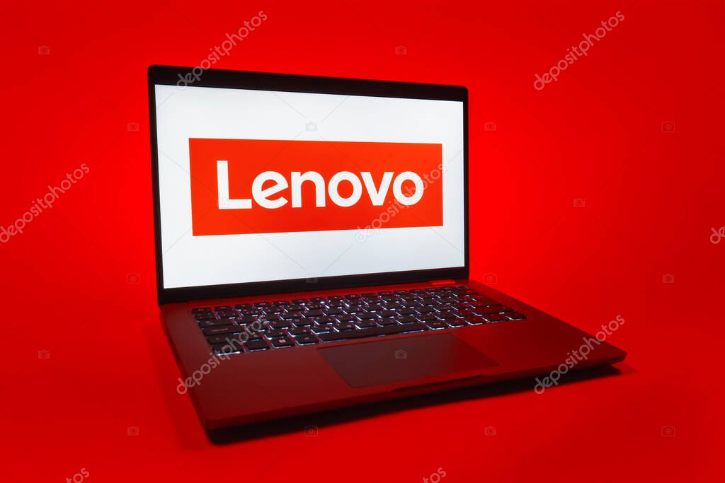 Prague, Czechia - 08 01 2025: A laptop on a uniform background displays the Lenovo logo. Lenovo is a technology company producing computers and electronics.