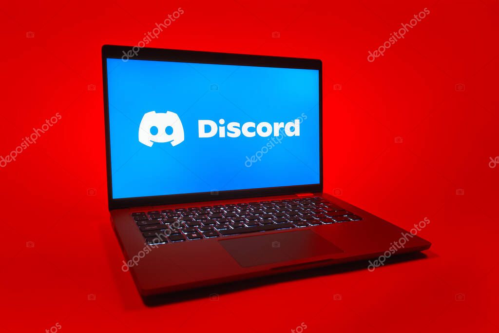 Prague, Czechia - 08 01 2025: A laptop on a uniform background displays the Discord logo. Discord is a platform for voice, video, and text communication.