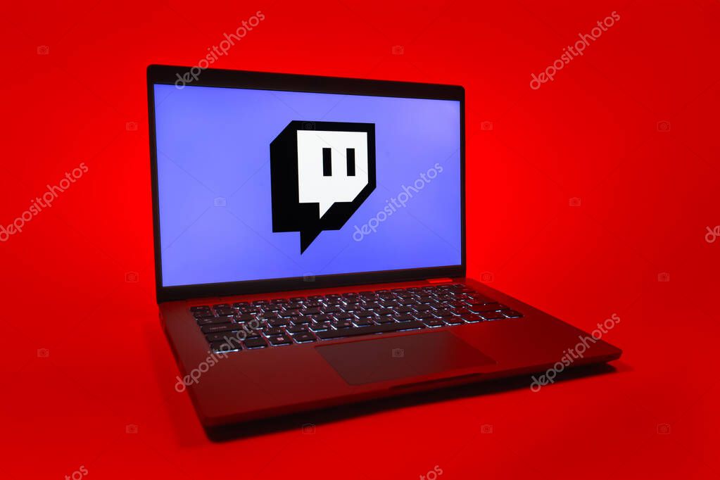 Prague, Czechia - 08 01 2025: A laptop on a uniform background displays the Twitch logo. Twitch is a platform for live streaming games and content.