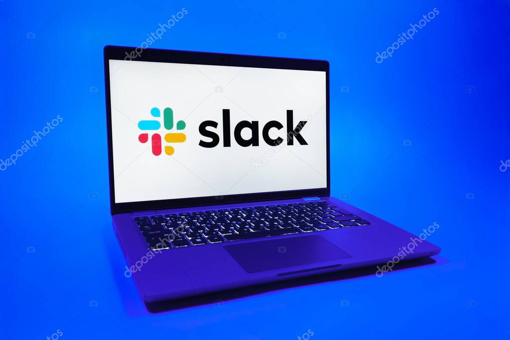 Prague, Czechia - 08 01 2025: A laptop on a uniform background displays the Slack logo. Slack is a platform for team messaging and workplace communication.