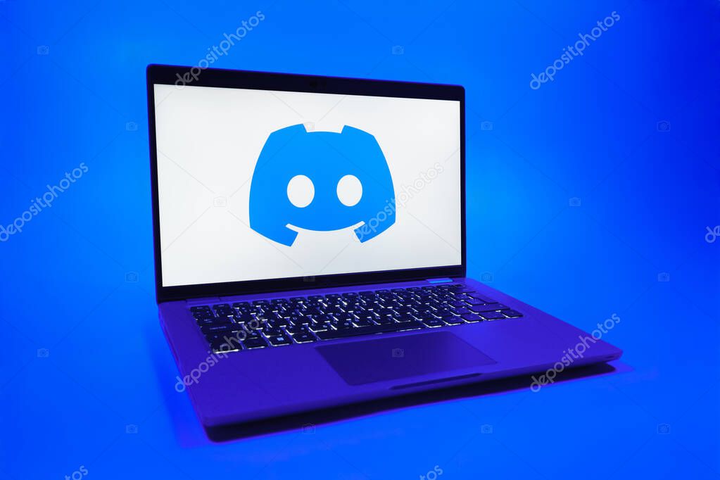 Prague, Czechia - 08 01 2025: A laptop on a uniform background displays the Discord logo. Discord is a platform for voice, video, and text communication.
