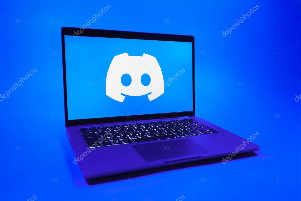 Prague, Czechia - 08 01 2025: A laptop on a uniform background displays the Discord logo. Discord is a platform for voice, video, and text communication.