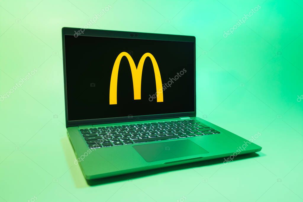 Prague, Czechia - 08 01 2025: A laptop on a uniform background displays the McDonalds logo. McDonalds is a fast-food chain serving burgers, fries, and more.