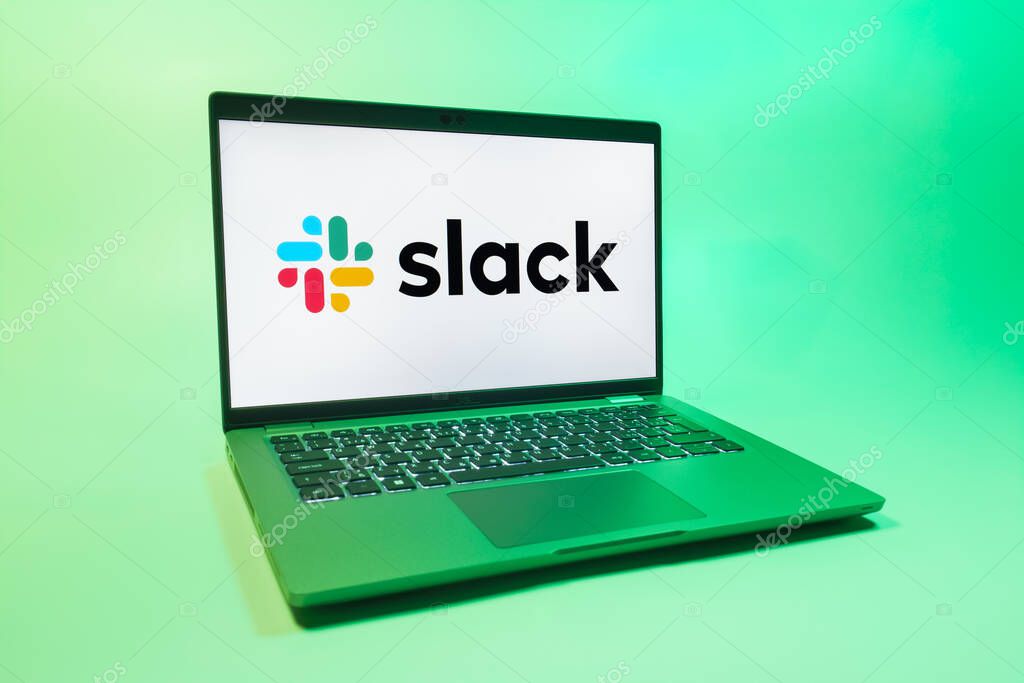 Prague, Czechia - 08 01 2025: A laptop on a uniform background displays the Slack logo. Slack is a platform for team messaging and workplace communication.