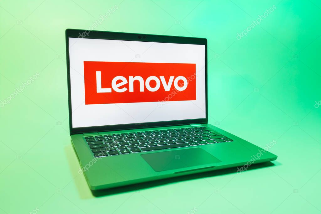 Prague, Czechia - 08 01 2025: A laptop on a uniform background displays the Lenovo logo. Lenovo is a technology company producing computers and electronics.