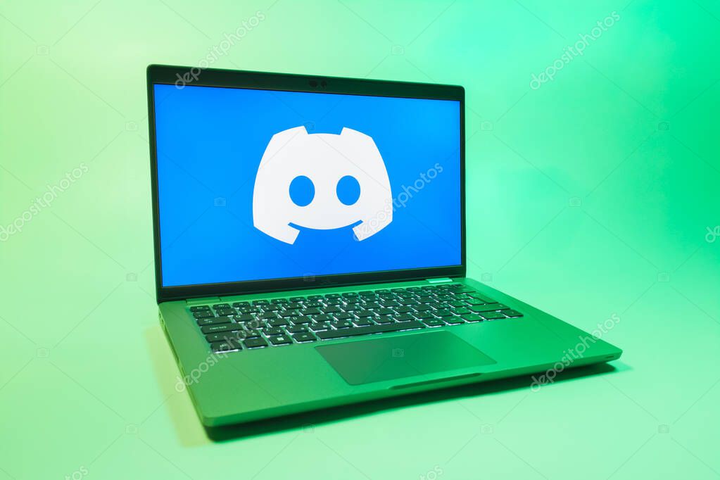 Prague, Czechia - 08 01 2025: A laptop on a uniform background displays the Discord logo. Discord is a platform for voice, video, and text communication.