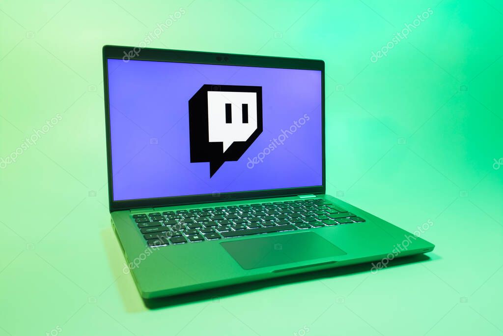 Prague, Czechia - 08 01 2025: A laptop on a uniform background displays the Twitch logo. Twitch is a platform for live streaming games and content.