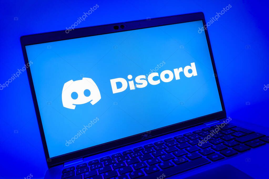Prague, Czechia - 08 01 2025: A close-up view of a laptop screen displaying the Discord logo. Discord is a platform for voice, video, and text communication.
