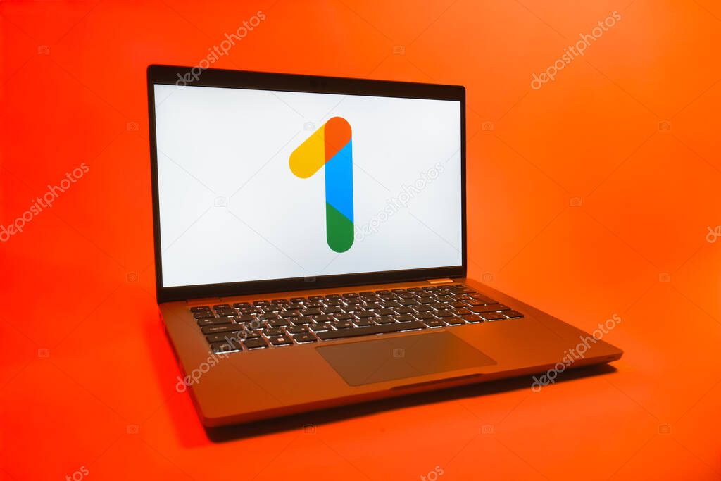Prague, Czechia - 08 01 2025: A laptop on a uniform background displays the Google One logo. Google One is a platform for cloud storage and subscription services.