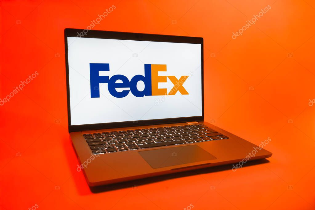 Prague, Czechia - 08 01 2025: A laptop on a uniform background displays the FedEX logo. FedEX is a logistics company providing shipping and courier services.