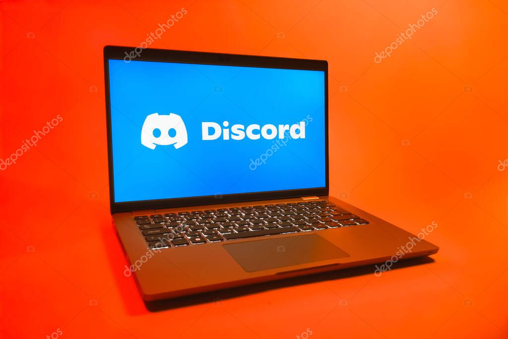 Prague, Czechia - 08 01 2025: A laptop on a uniform background displays the Discord logo. Discord is a platform for voice, video, and text communication.