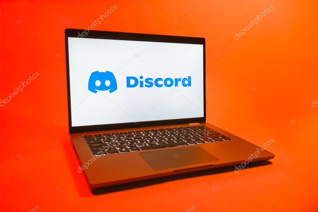 Prague, Czechia - 08 01 2025: A laptop on a uniform background displays the Discord logo. Discord is a platform for voice, video, and text communication.
