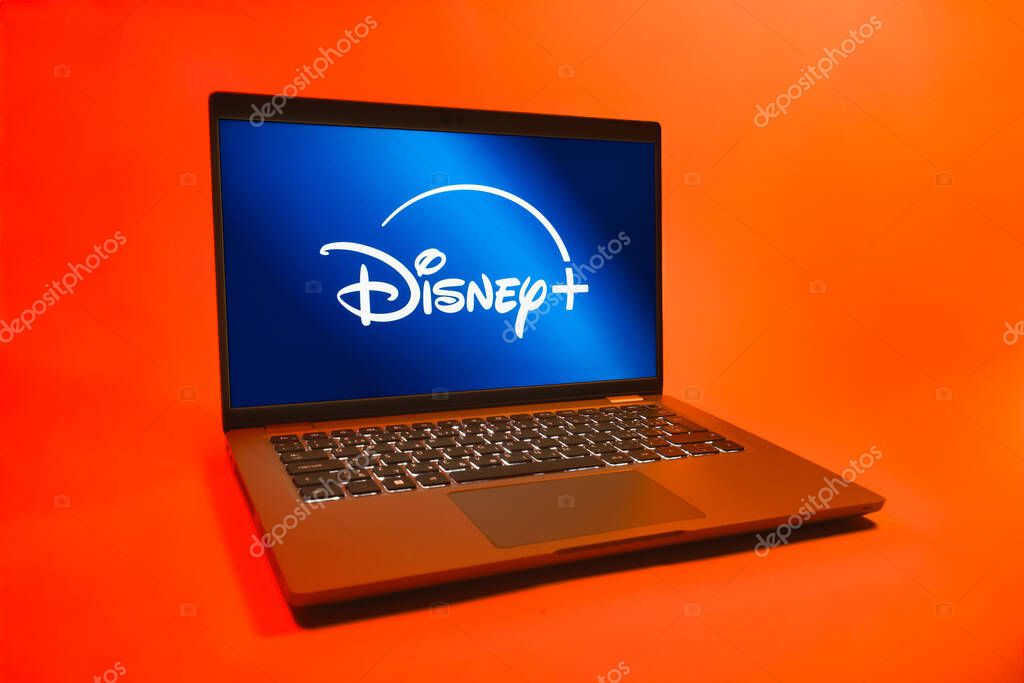 Prague, Czechia - 08 01 2025: A laptop on a uniform background displays the Disney+ logo. Disney + is a streaming platform for movies and TV shows.