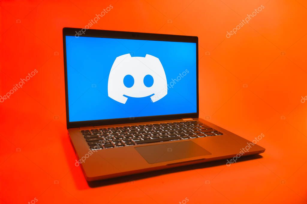 Prague, Czechia - 08 01 2025: A laptop on a uniform background displays the Discord logo. Discord is a platform for voice, video, and text communication.