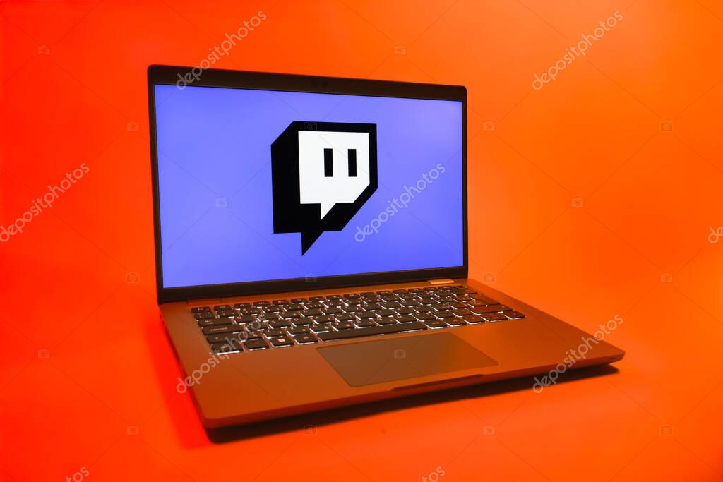 Prague, Czechia - 08 01 2025: A laptop on a uniform background displays the Twitch logo. Twitch is a platform for live streaming games and content.