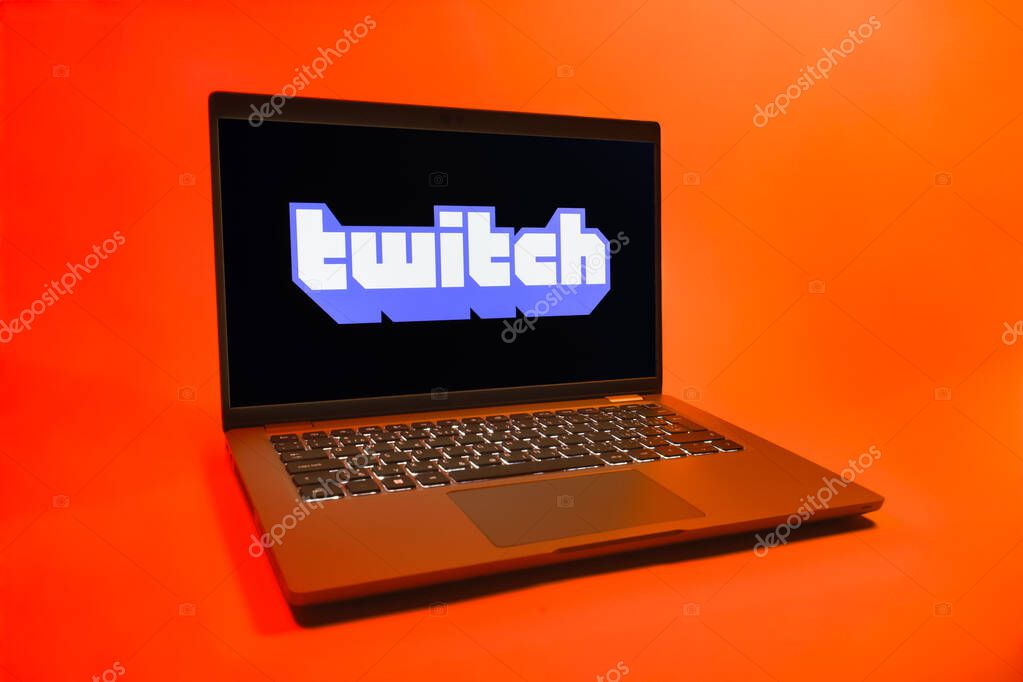 Prague, Czechia - 08 01 2025: A laptop on a uniform background displays the Twitch logo. Twitch is a platform for live streaming games and content.