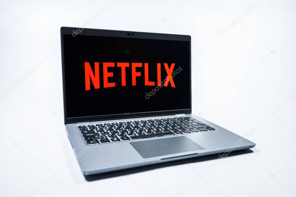Prague, Czechia - 08 01 2025: A laptop on a uniform background displays the Netflix logo. Netflix is a streaming platform for movies and TV shows.