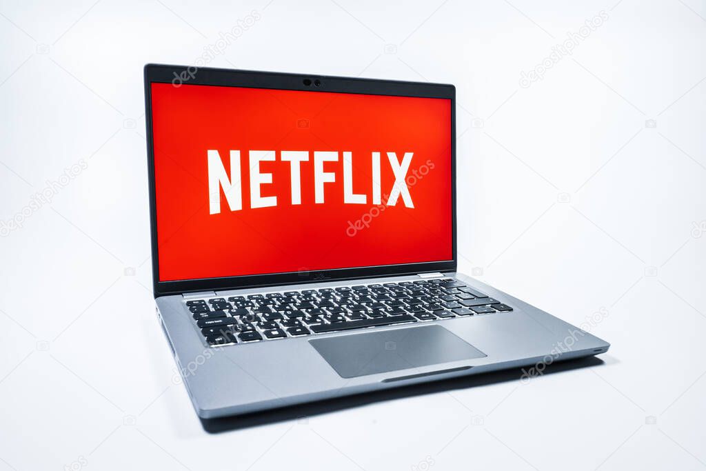 Prague, Czechia - 08 01 2025: A laptop on a uniform background displays the Netflix logo. Netflix is a streaming platform for movies and TV shows.
