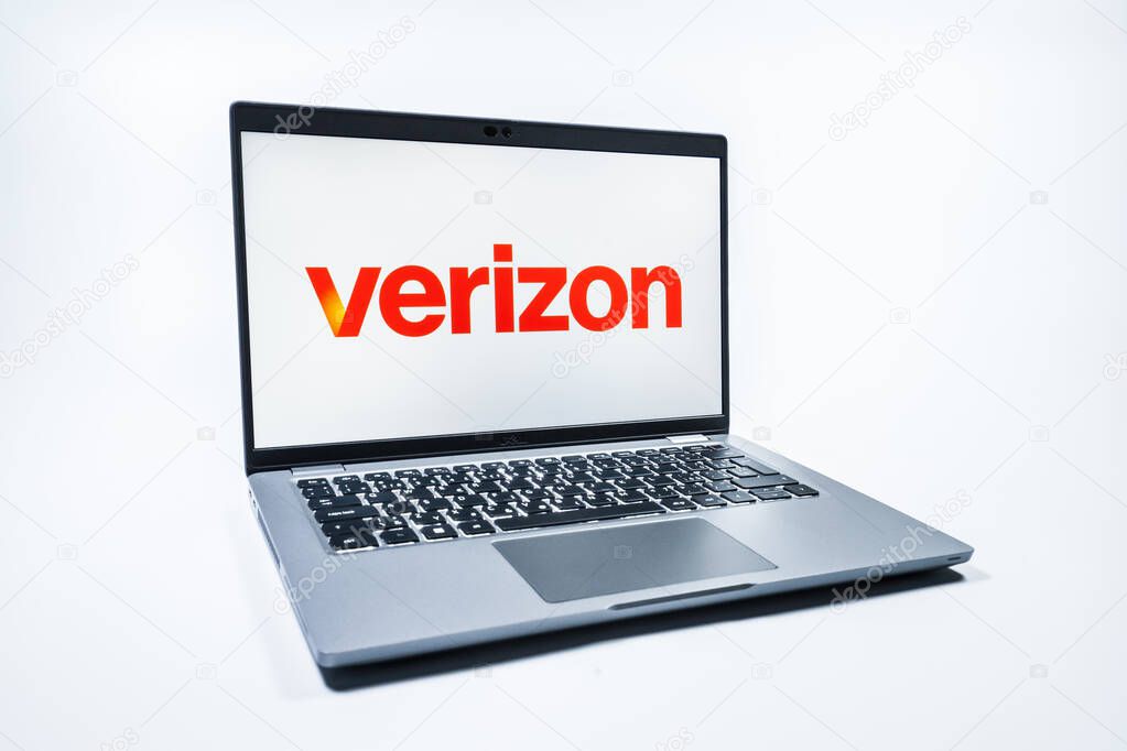 Prague, Czechia - 08 01 2025: A laptop on a uniform background displays the Verizon logo. Verizon is a telecom company providing wireless and broadband services.
