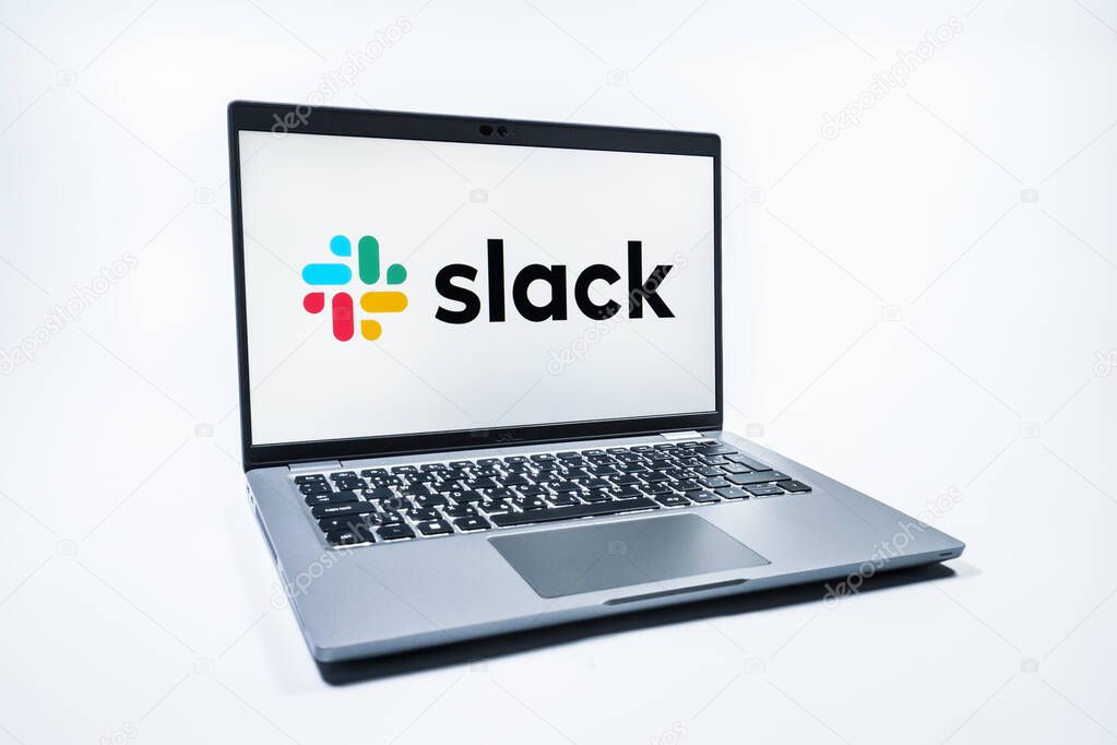 Prague, Czechia - 08 01 2025: A laptop on a uniform background displays the Slack logo. Slack is a platform for team messaging and workplace communication.