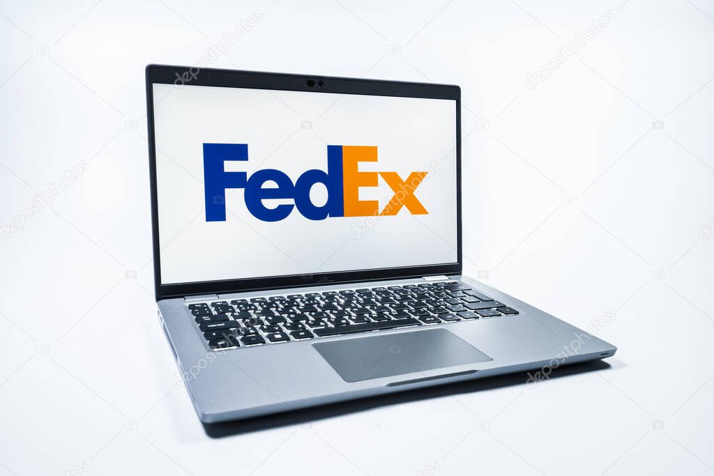 Prague, Czechia - 08 01 2025: A laptop on a uniform background displays the FedEX logo. FedEX is a logistics company providing shipping and courier services.