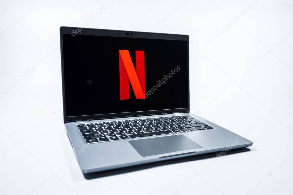 Prague, Czechia - 08 01 2025: A laptop on a uniform background displays the Netflix logo. Netflix is a streaming platform for movies and TV shows.