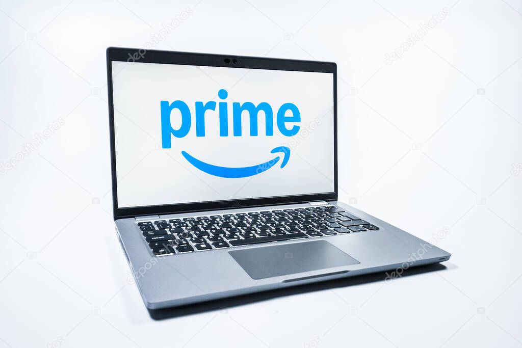 Prague, Czechia - 08 01 2025: A laptop on a uniform background displays the Prime logo. Prime is a subscription service for shopping, streaming, and benefits.
