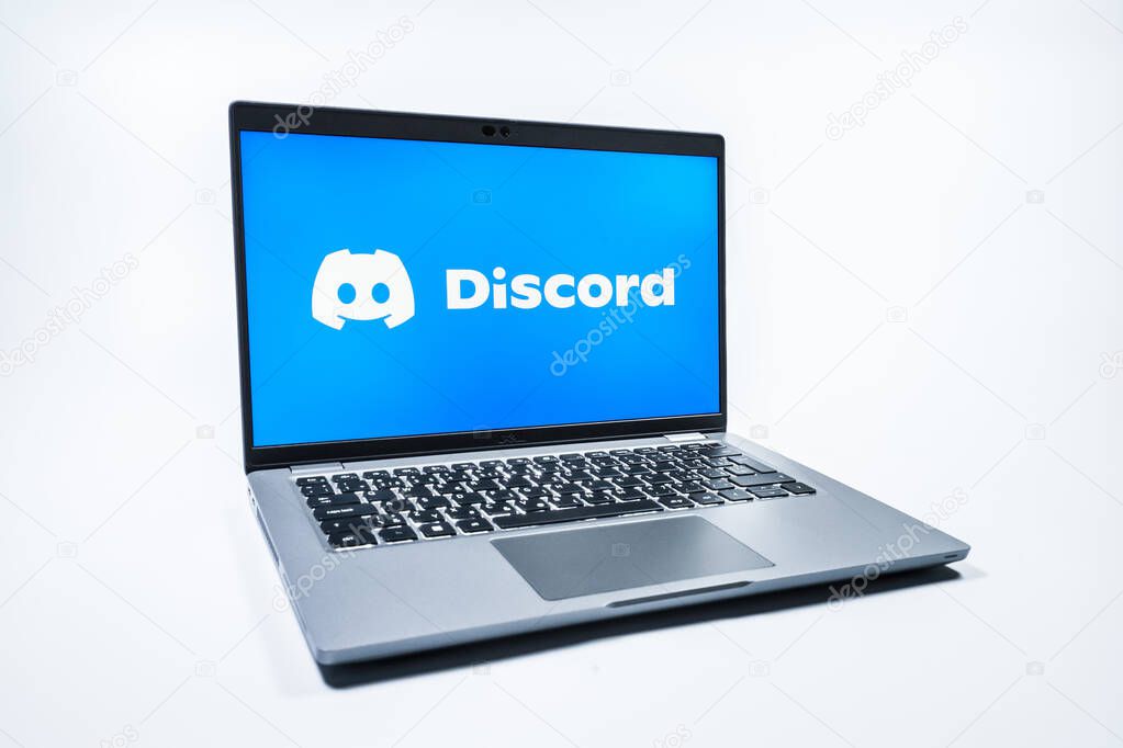 Prague, Czechia - 08 01 2025: A laptop on a uniform background displays the Discord logo. Discord is a platform for voice, video, and text communication.