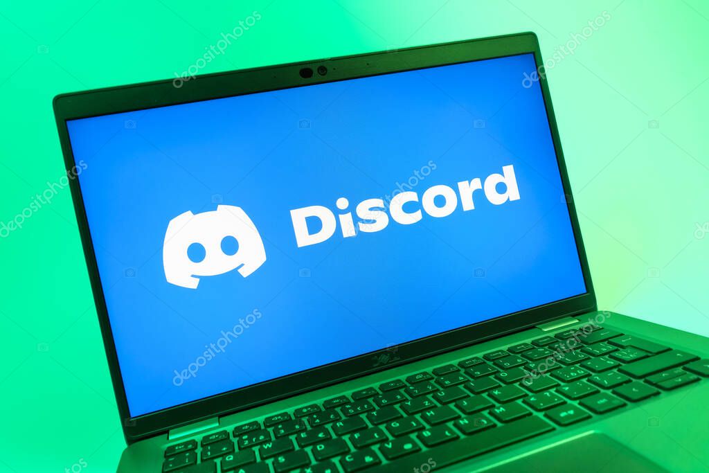 Prague, Czechia - 08 01 2025: A close-up view of a laptop screen displaying the Discord logo. Discord is a platform for voice, video, and text communication.
