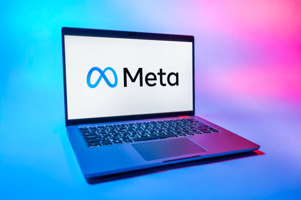 Prague, Czechia - 08 01 2025: A laptop on a uniform background displays the Meta logo. Meta is a company offering social platforms like Facebook and Instagram.