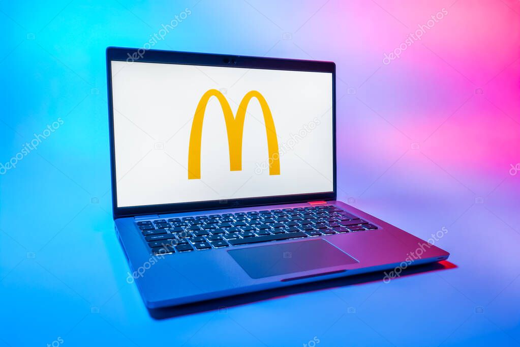 Prague, Czechia - 08 01 2025: A laptop on a uniform background displays the McDonalds logo. McDonalds is a fast-food chain serving burgers, fries, and more.