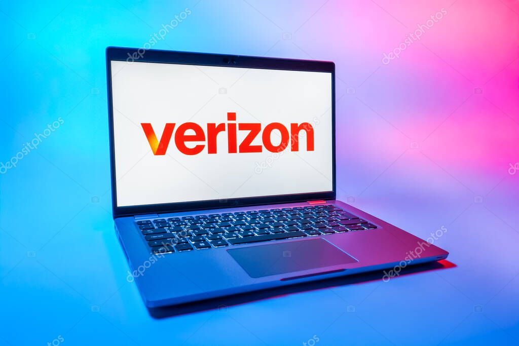 Prague, Czechia - 08 01 2025: A laptop on a uniform background displays the Verizon logo. Verizon is a telecom company providing wireless and broadband services.