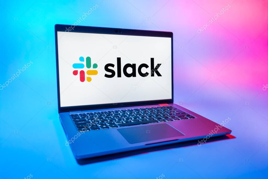 Prague, Czechia - 08 01 2025: A laptop on a uniform background displays the Slack logo. Slack is a platform for team messaging and workplace communication.