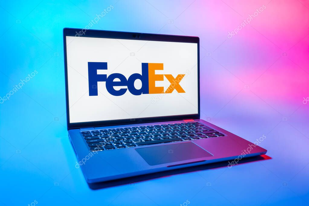 Prague, Czechia - 08 01 2025: A laptop on a uniform background displays the FedEX logo. FedEX is a logistics company providing shipping and courier services.
