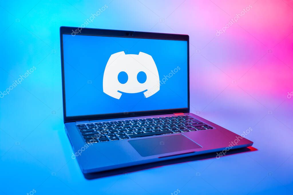 Prague, Czechia - 08 01 2025: A laptop on a uniform background displays the Discord logo. Discord is a platform for voice, video, and text communication.