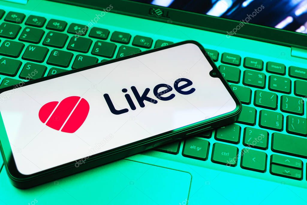 Prague, Czechia - 08 01 2025: A mobile phone lying on a laptop keyboard displays the Likee logo. Likee is a platform for creating and sharing short videos.