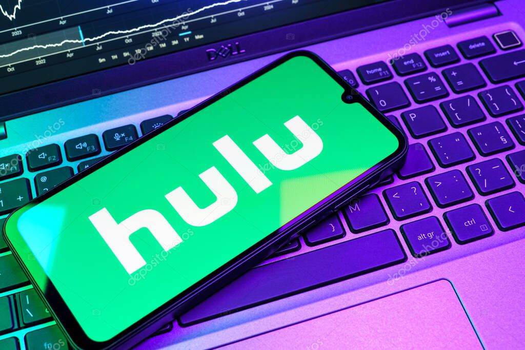 Prague, Czechia - 08 18 2025: A mobile phone on a keyboard displays Hulu logo. Hulu is a streaming platform for TV shows, movies, and live TV.