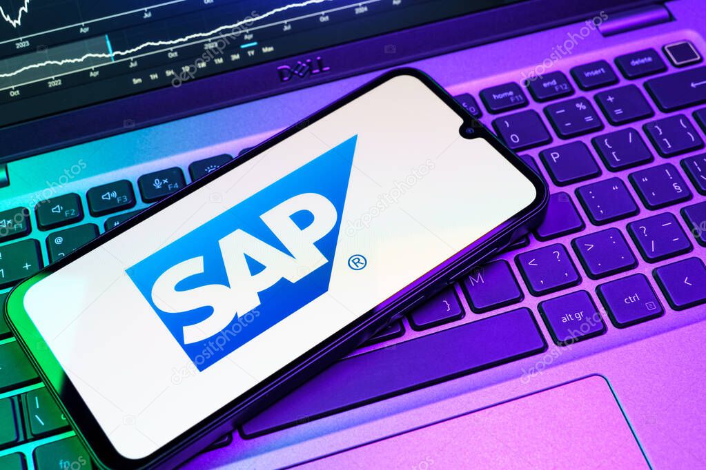 Prague, Czechia - 08 18 2025: A mobile phone on a keyboard displays SAP logo. SAP is a software company providing enterprise applications and solutions.