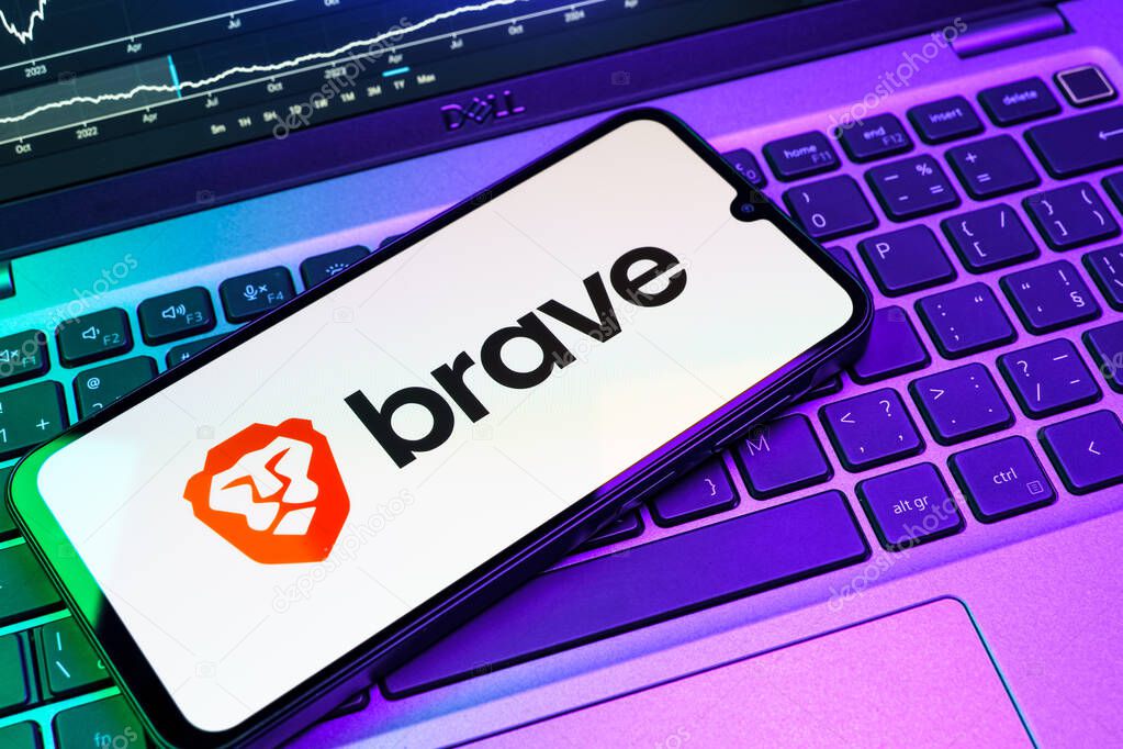 Prague, Czechia - 08 18 2025: A mobile phone on a keyboard displays Brave logo. Brave is a web browser focused on privacy and speed.