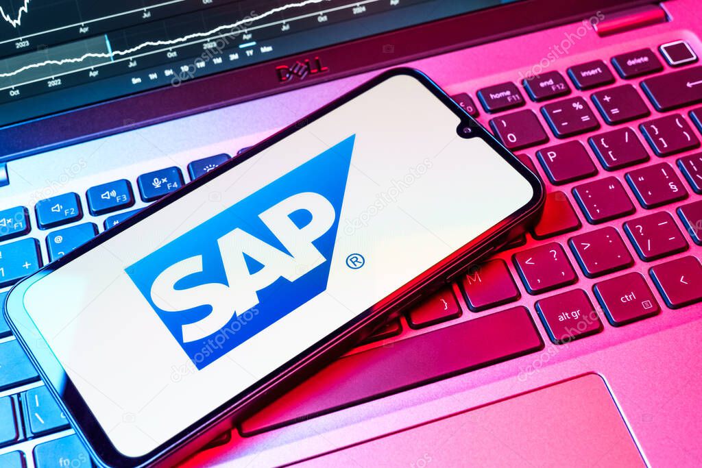 Prague, Czechia - 08 18 2025: A mobile phone on a keyboard displays SAP logo. SAP is a software company providing enterprise applications and solutions.