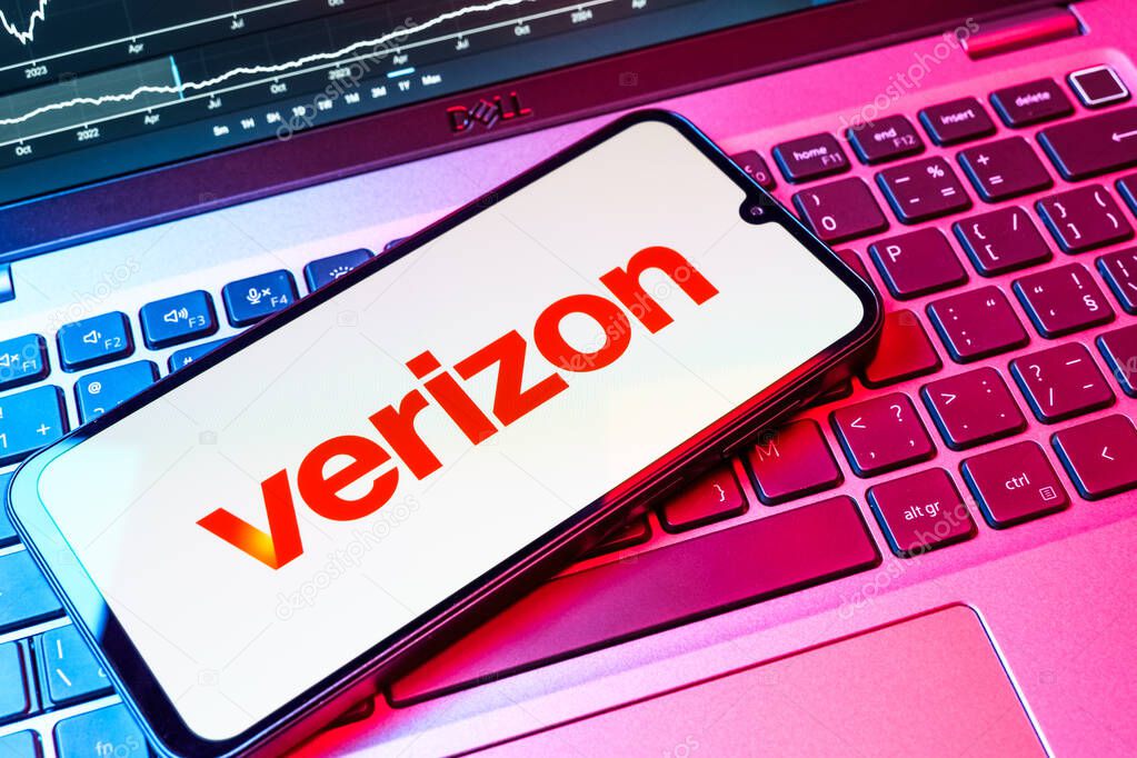 Prague, Czechia - 08 18 2025: A mobile phone on a keyboard displays Verizon logo. Verizon is a telecom company providing wireless and broadband services.