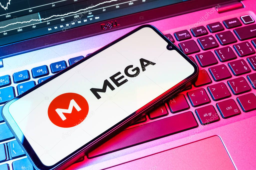 Prague, Czechia - 08 18 2025: A mobile phone on a keyboard displays Mega logo. Mega is a platform for cloud storage with encrypted file sharing.