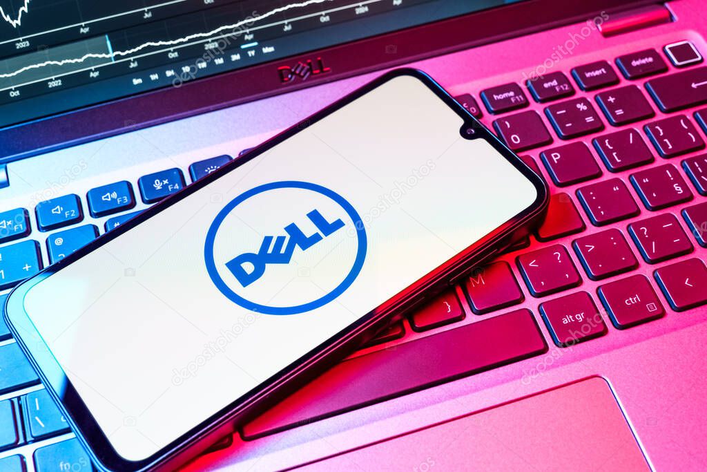 Prague, Czechia - 08 18 2025: A mobile phone on a keyboard displays Dell logo. Dell is a technology company producing computers and IT solutions.