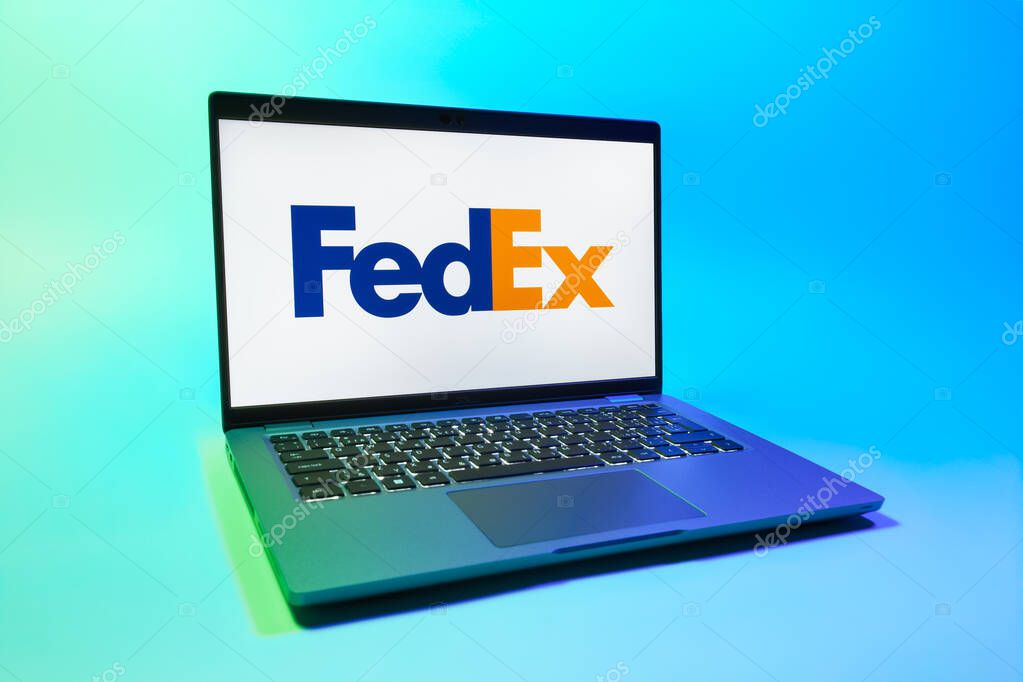 Prague, Czechia - 08 01 2025: A laptop on a uniform background displays the FedEX logo. FedEX is a logistics company providing shipping and courier services.