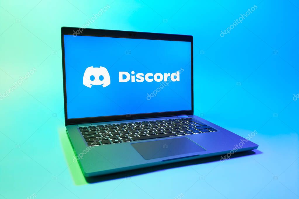 Prague, Czechia - 08 01 2025: A laptop on a uniform background displays the Discord logo. Discord is a platform for voice, video, and text communication.