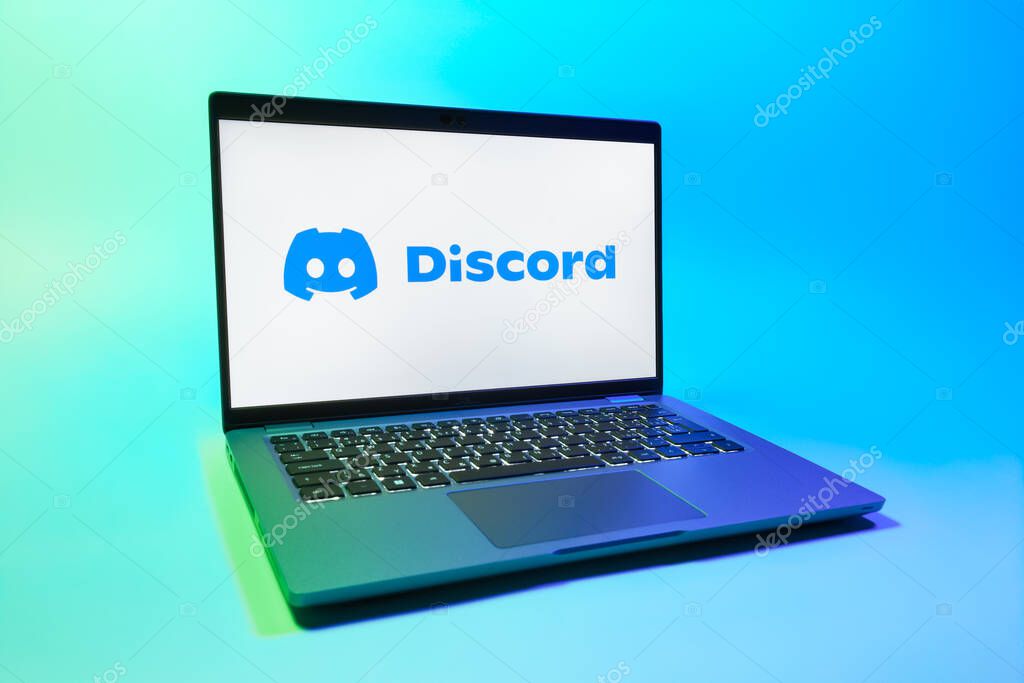 Prague, Czechia - 08 01 2025: A laptop on a uniform background displays the Discord logo. Discord is a platform for voice, video, and text communication.