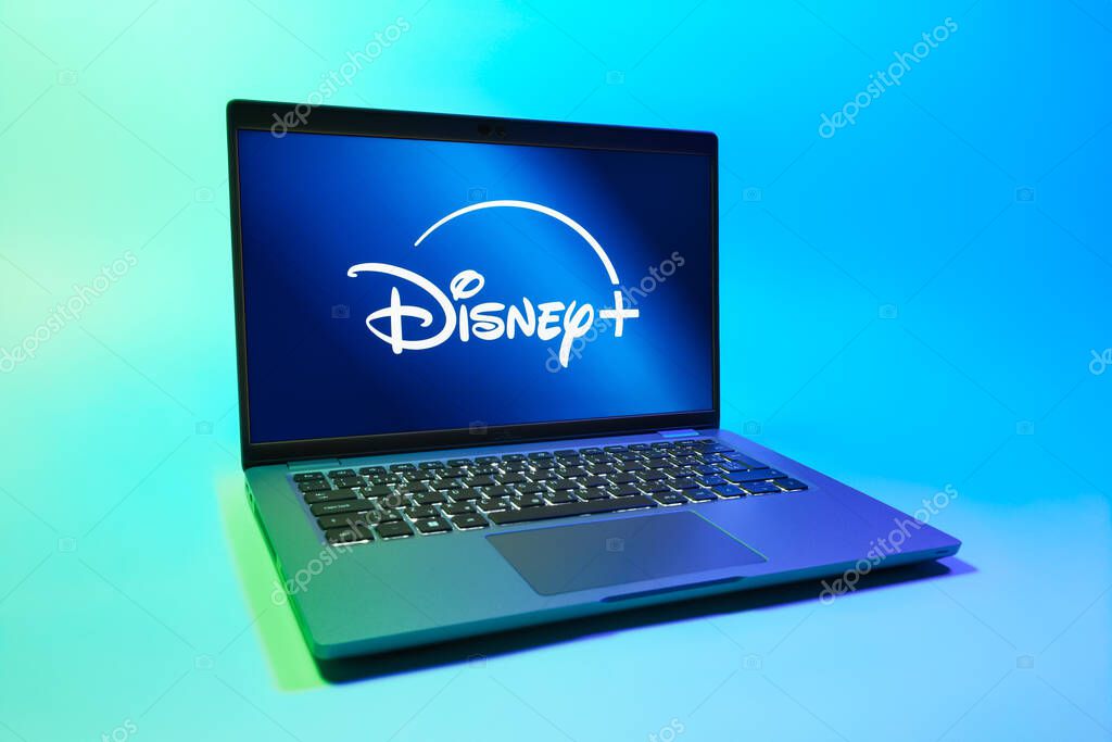 Prague, Czechia - 08 01 2025: A laptop on a uniform background displays the Disney+ logo. Disney + is a streaming platform for movies and TV shows.